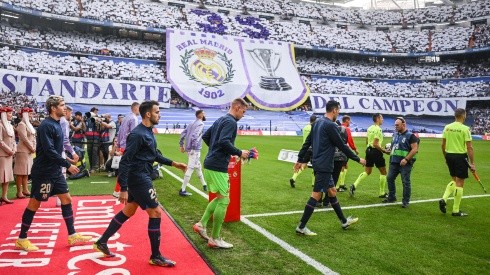 Barcelona players walk onto the pitch against Real Madrid
