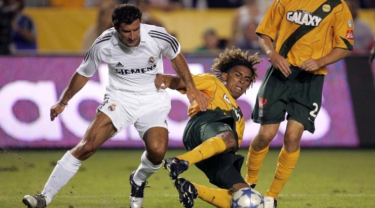 Luis Filipe Figo #10 of the Real Madrid and Guillermo Pando Ramirez #17 of the Los Angeles Galaxy clash during the game at the Home Depot Center on July 18, 2005 in Carson, California. (Photo by Stephen Dunn/Getty Images)