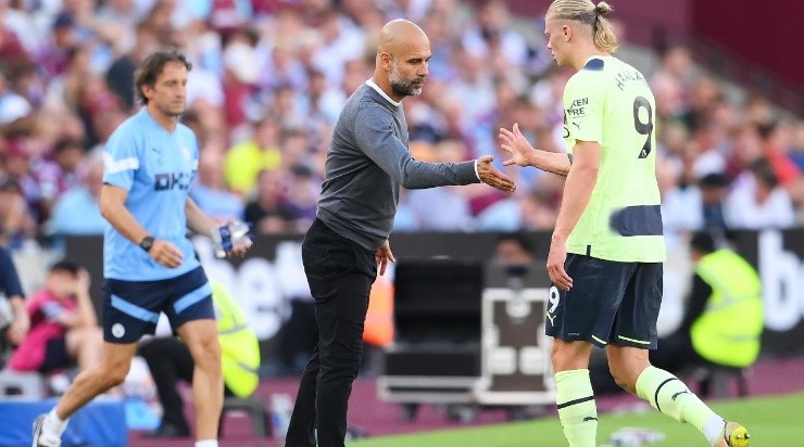 Pep Guardiola, Manager of Manchester City interacts with Erling Haaland (Photo by Mike Hewitt/Getty Images)