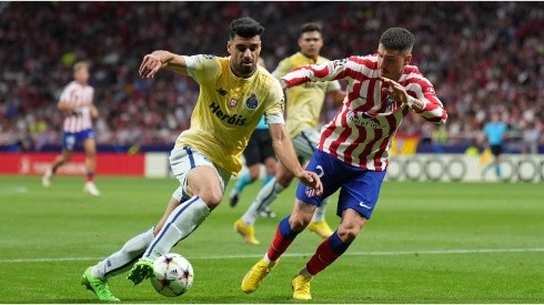 Mehdi Taremi of FC Porto turns with the ball under pressure from Jose Gimenez of Atletico de Madrid