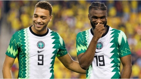 Cyriel Dessers (L) and Terem Moffi (R) of Nigeria laugh before a game against Ecuador