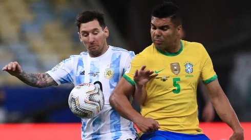 Messi (left) of Argentina fighting for ball control against Casemiro of Brazil