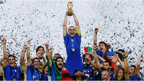 The Italian players celebrate as Fabio Cannavaro of Italy lifts the World Cup trophy