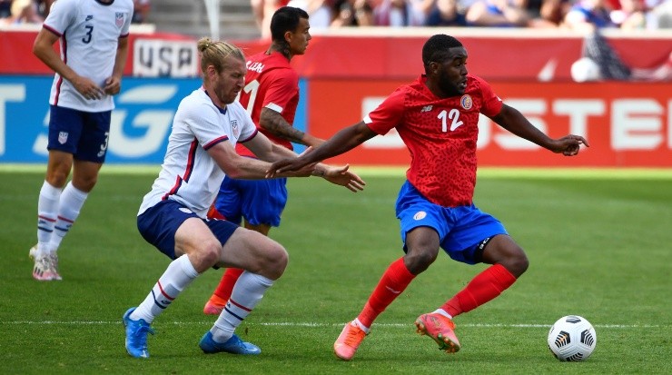 SANDY, UTAH - JUNE 09: Joel Campbell #12 of Costa Rica fights for the ball with Tim Ream #13 of the United States during a game at Rio Tinto Stadium on June 09, 2021 in Sandy, Utah. (Photo by Alex Goodlett/Getty Images)-Not Released (NR)