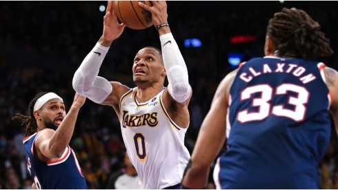 Russell Westbrook of the Los Angeles Lakers is defended by Patty Mills and Claxton of the Brooklyn Nets