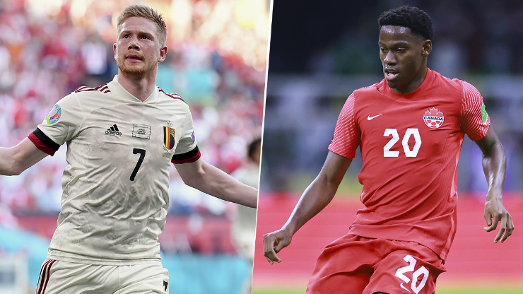 Kevin De Bruyne y Jonathan David, figuras de Bélgica y Canadá respectivamente.