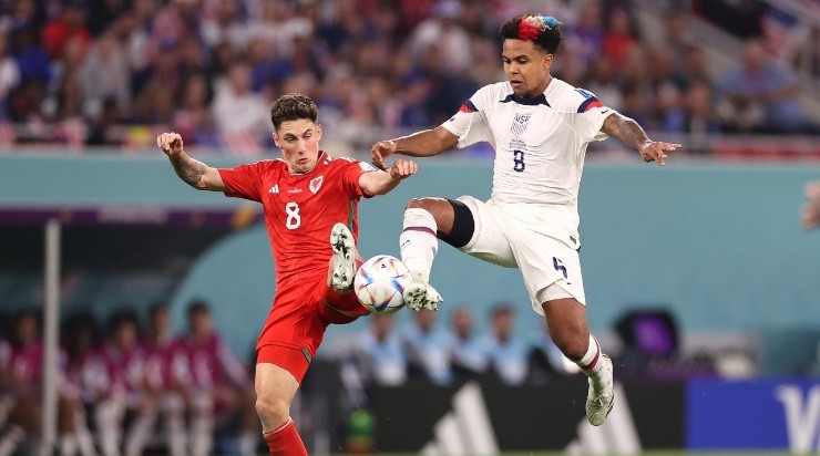 Harry Wilson of Wales battles for possession with Weston McKennie of United States  (Photo by Ryan Pierse/Getty Images)