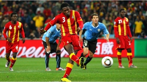 Asamoah Gyan of Ghana shoots a late penalty