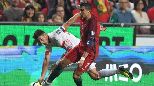 Cristiano Ronaldo of Portugal competes for the ball with Fabian Schar of Switzerland during the FIFA 2018 World Cup Qualifier