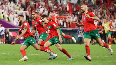 Morocco players celebrate after the team's victory in the penalty shoot out