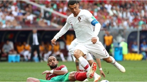 Cristiano Ronaldo of Portugal is fouled by Mehdi Benatia of Morocco