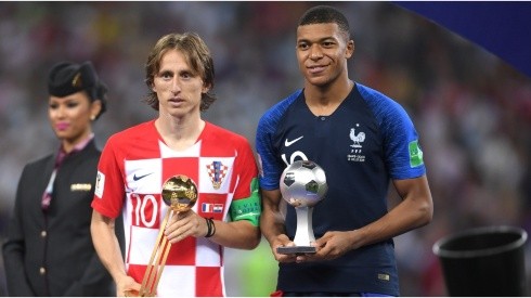 Luka Modric of Croatia and Kylian Mbappe of France pose respectively with their the adidas Golden Ball and with the FIFA Young Player award