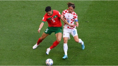 Nayef Aguerd of Morocco battles for possession with Luka Modric of Croatia