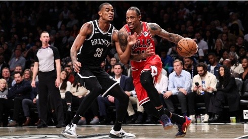 DeMar DeRozan of the Chicago Bulls is defended by Nicolas Claxton of the Brooklyn Nets