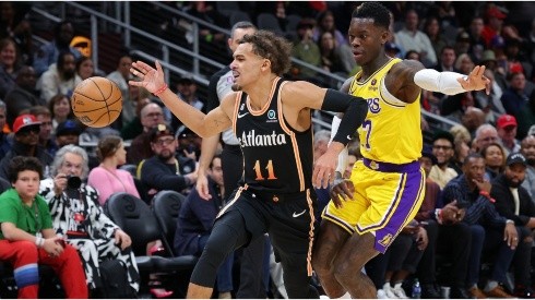 Trae Young of the Atlanta Hawks loses the ball as he drives against Dennis Schroder of the Los Angeles Lakers
