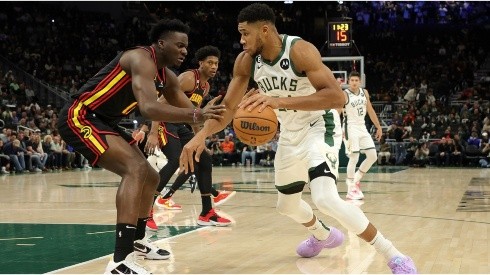 Giannis Antetokounmpo of the Milwaukee Bucks is defended by Clint Capela of the Atlanta Hawks