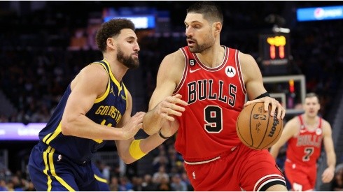 Nikola Vucevic #9 of the Chicago Bulls is guarded by Klay Thompson #11 of the Golden State Warriors