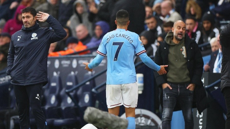 Cancelo y Pep Guardiola.