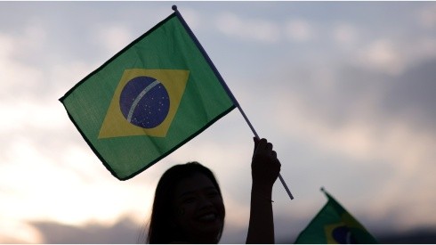 Fans wave a Brazil flag