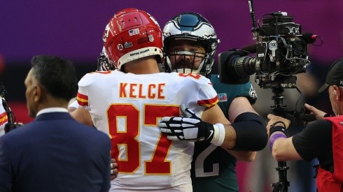 Jason and Travis Kelce hug each other after the Super Bowl LVII.