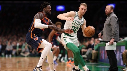 Julius Randle #30 of the New York Knicks defends Sam Hauser #30 of the Boston Celtics