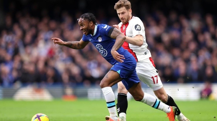 Raheem Sterling of Chelsea runs with the ball whilst under pressure from Stuart Armstrong of Southampton  (Photo by Julian Finney/Getty Images)