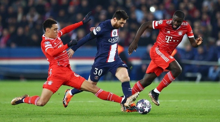 Lionel Messi of Paris Saint-Germain is challenged by Jamal Musiala and is marked by Dayot Upamecano of FC Bayern Munich  (Photo by Clive Rose/Getty Images)
