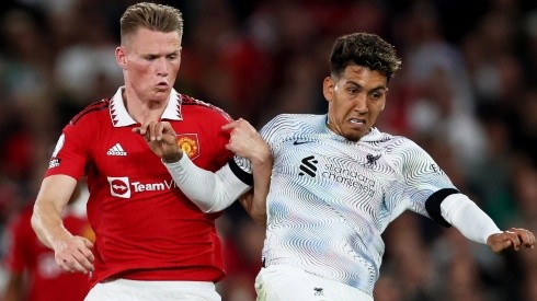 Scott McTominay of Manchester United and Roberto Firmino of Liverpool