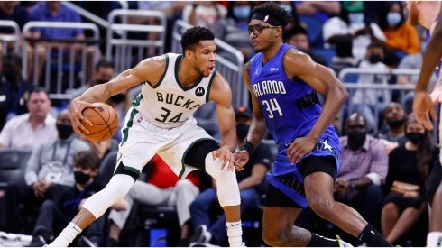 Giannis Antetokounmpo #34 of the Milwaukee Bucks drives to the basket against Wendell Carter Jr. #34 of the Orlando Magic