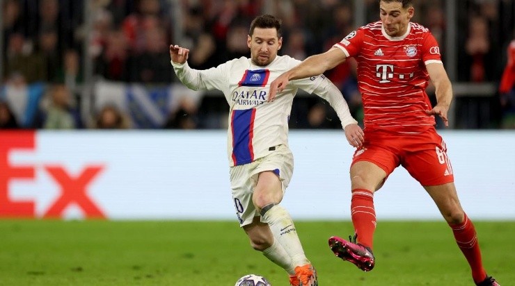 Lionel Messi of Paris Saint-Germain battles for possession with Leon Goretzka of FC Bayern Munich  (Photo by Alexander Hassenstein/Getty Images)