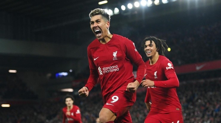 Roberto Firmino of Liverpool celebrates after scoring the team&#039;s seventh goal with teammate Trent Alexander-Arnold during the Premier League match between Liverpool FC and Manchester United at Anfield on March 05, 2023 in Liverpool, England. (Photo by Michael Regan/Getty Images)