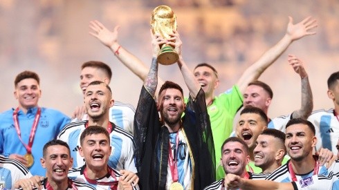 Lionel Messi lifts the FIFA World Cup trophy at Qatar 2022.