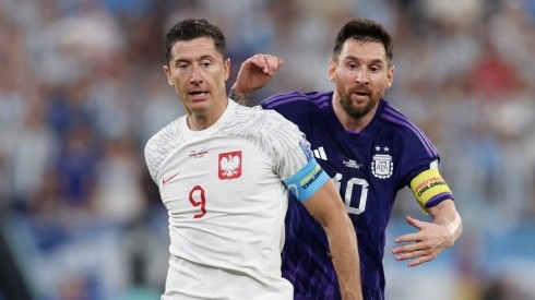 Lionel Messi of Argentina is challenged by Robert Lewandowski of Poland during the FIFA World Cup Qatar 2022 Group C match between Poland and Argentina at Stadium 974 on November 30, 2022 in Doha, Qatar.