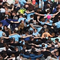 Why do Manchester City fans turn their backs?