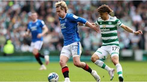 Todd Cantwell of Rangers FC is put under pressure by Jota of Celtic
