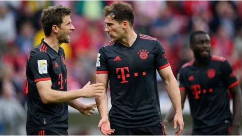 Thomas Mueller of Bayern Munich discusses with Leon Goretzka