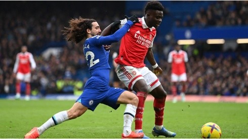 Bukayo Saka of Arsenal holds off Marc Cucurella of Chelsea