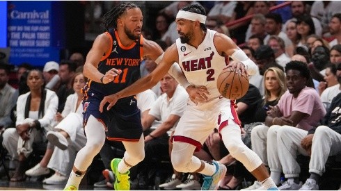 Gabe Vincent #2 of the Miami Heat dribbles the basketball while being defended by Jalen Brunson #11 of the New York Knicks