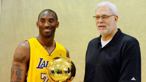 Kobe Bryant and Phil Jackson pose with NBA Finals Larry O'Brien Championship Trophy.