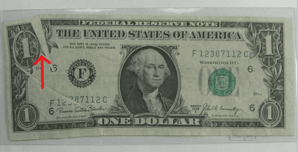El billete de un 1 dólar con un error “Glutter note”.