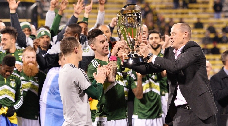 Liam Ridgewell (center) of the Portland Timbers lifts the 2015 MLS Cup Trophy. (Jamie Sabau/Getty Images)