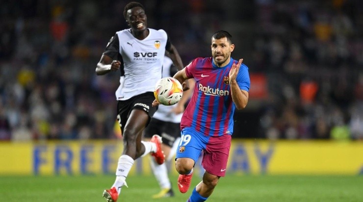Sergio Aguero of FC Barcelona runs with the ball away from Mouctar Diakhaby of Valencia CF (Photo by David Ramos/Getty Images)