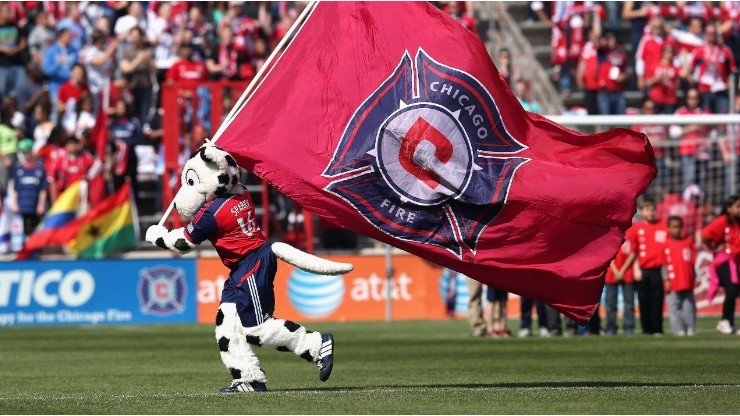 Sparky, the mascot for the Chicago Fire, runs with a flag before an MLS match (Getty).