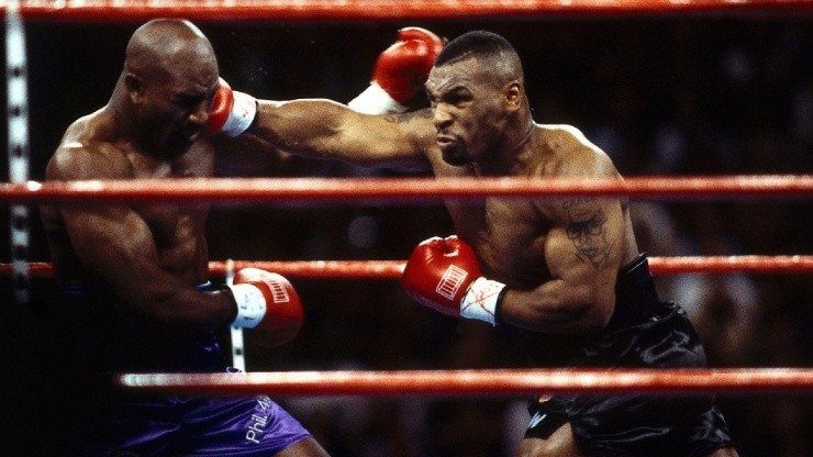 Mike Tyson connects against Evander Holyfield during the 1996 WBA World Heavyweight Title fight (Orissadiary)