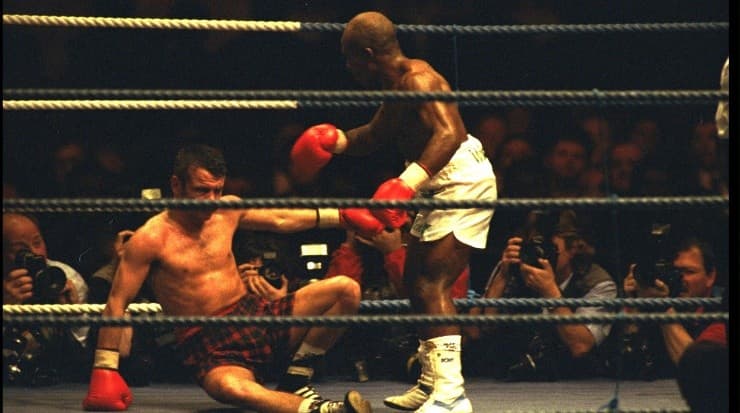 Baby Jake Marlala stands over the fallen Pat Clinton. Clinton won the fight (Getty)