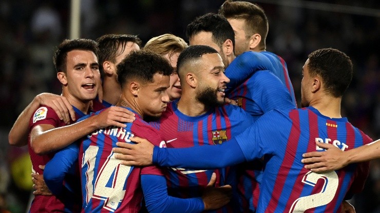 Barcelona players celebrate after scoring a goal