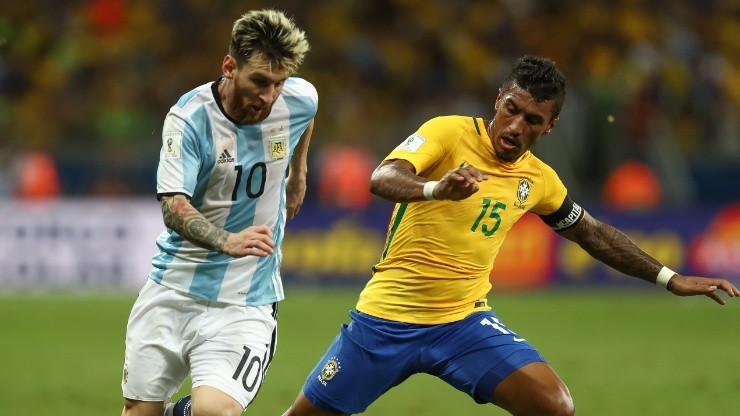 Lionel Messi of Argentina (left) against Paulinho of Brazil during a World Cup Qualifier in 2016.