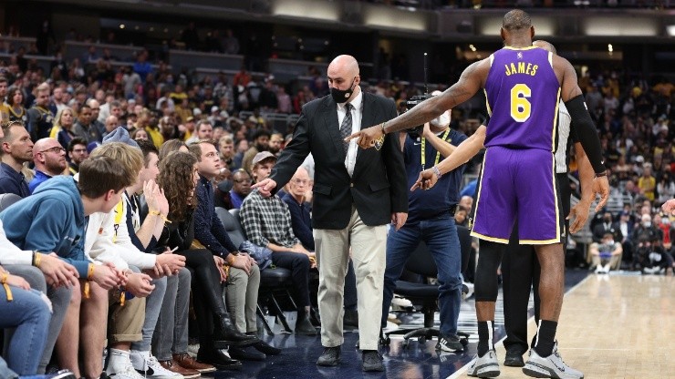 LeBron James #6 of the Los Angeles Lakers points out fans that he had a disturbance with to security during the game against the Indiana Pacers.