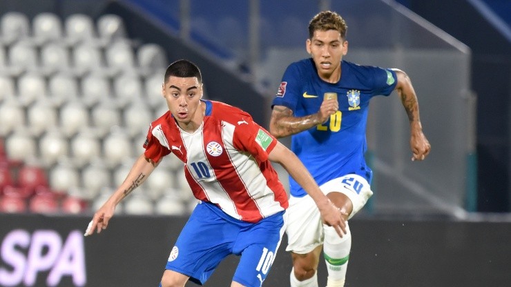 Miguel Almiron of Paraguay (left) against Roberto Firmino of Brazil.