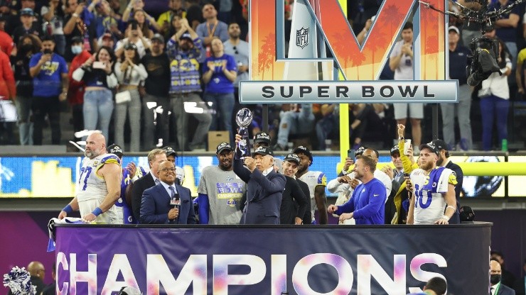 Owner of the Los Angeles Rames Stan Kroenke holds up the Vince Lombardi Trophy after Super Bowl LVI.